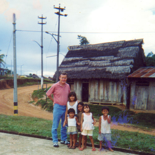 Leon with a Peruvian Family in front of their home in Iquotos, Peru.
