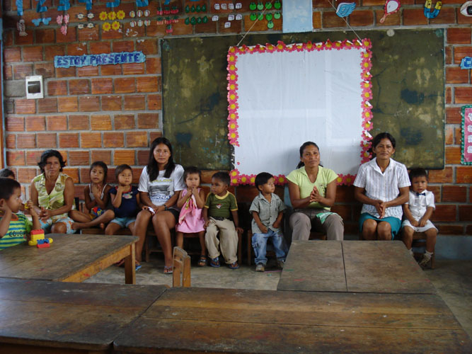 Parent and children at elementary class room open house.