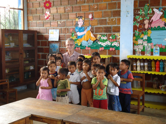Some of the children gathered around Dean Logan for photo session.