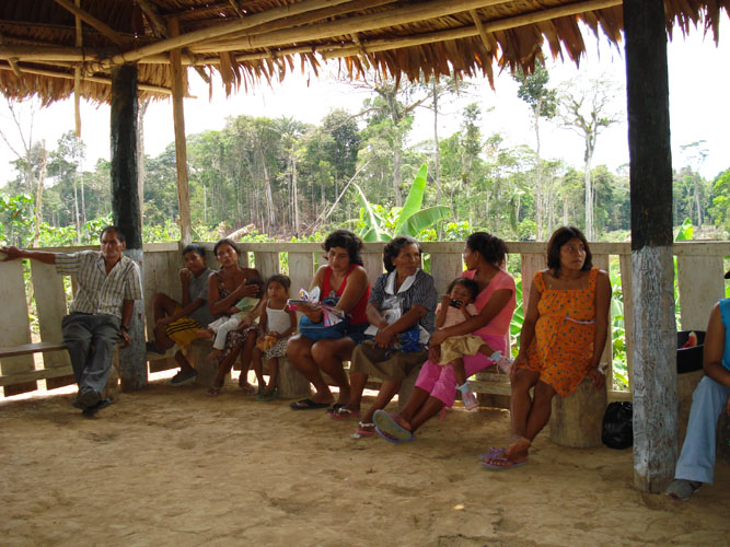 Community villagers gather for Sunday morning meeting.