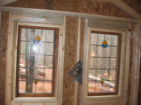   This is an interesting photo. At first I though it was out of focus. Then I noticed the tools, label on the wood and wood around the windows was not out of focus. What I got was that the windows were literally vibrating with excitement at being in 