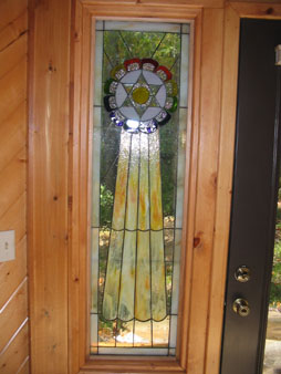 Stained Glass Side Panels to the Entrance Door to the Chapel replicating the Sacred Symbol of Mu (Colonel James Churchward).