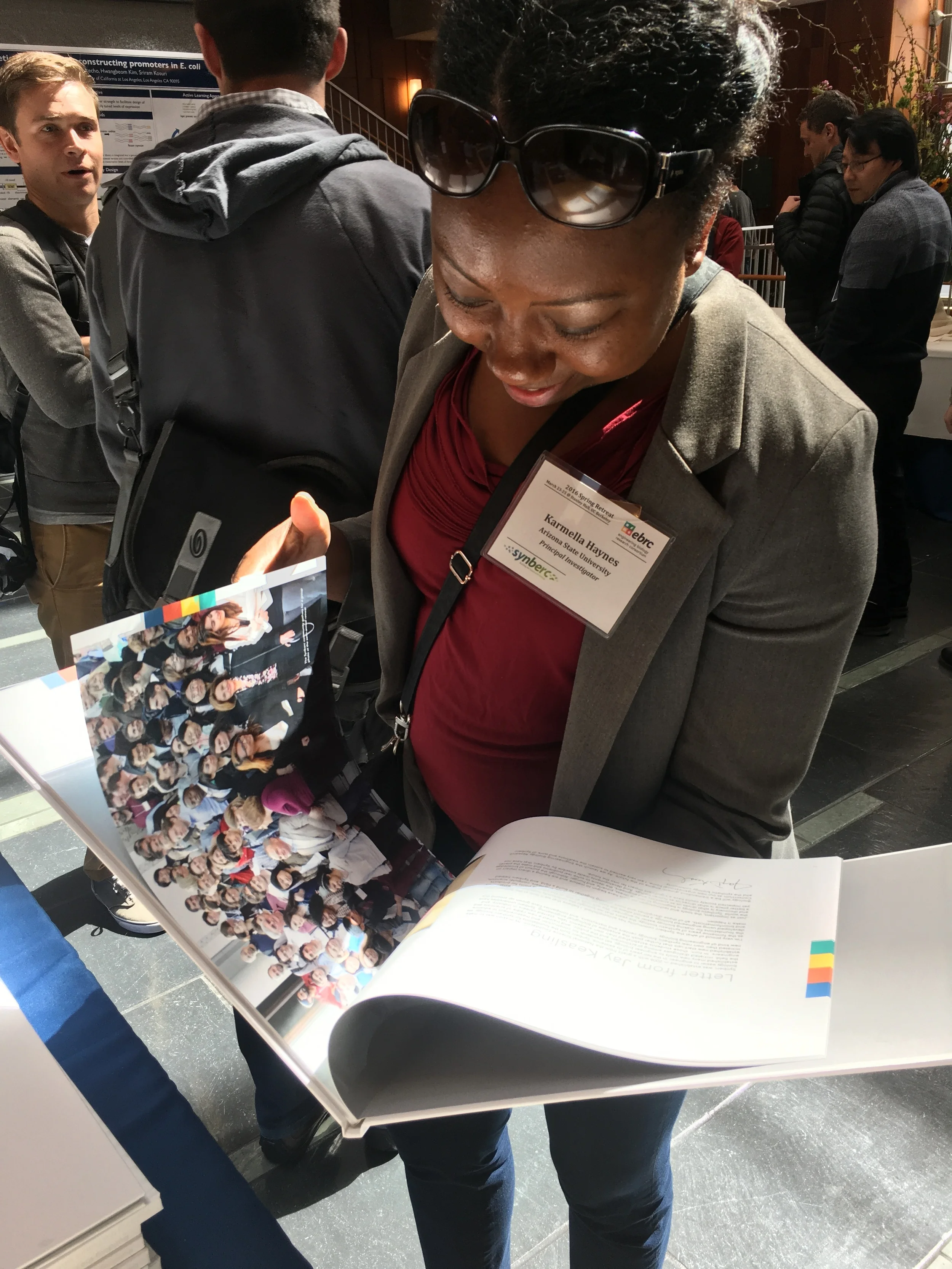 EBRC Board member and researcher ( ARIZONA STATE) Karmella Haynes thumbs through the pages of the book