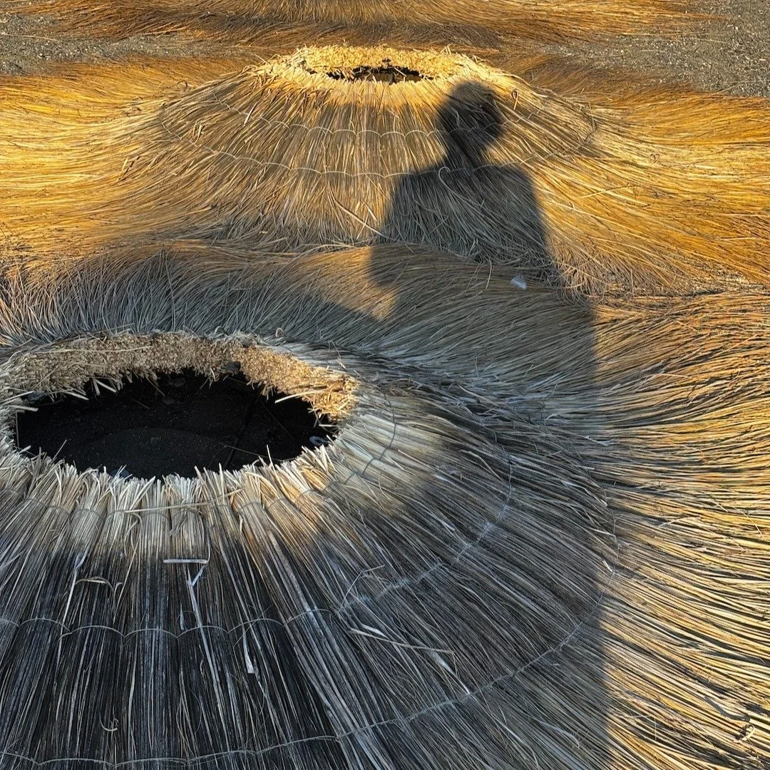Me towering over some volcanic craters or, my shadow over some beach bar 'hat's on a beach in Spain?!