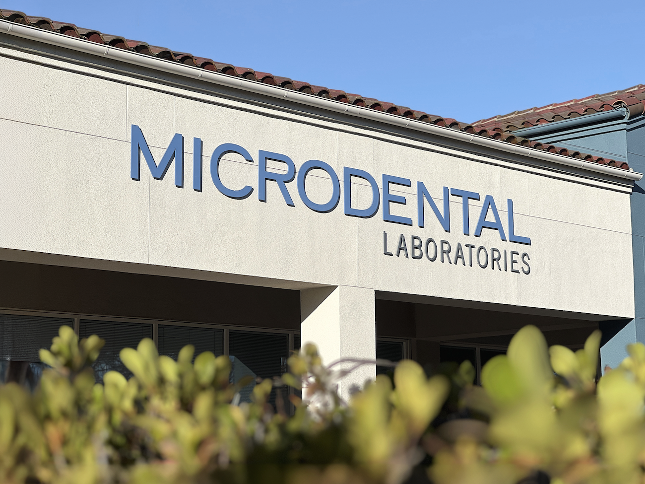MicroDental Laboratories building sign on the front of the MicroDental office headquarters.