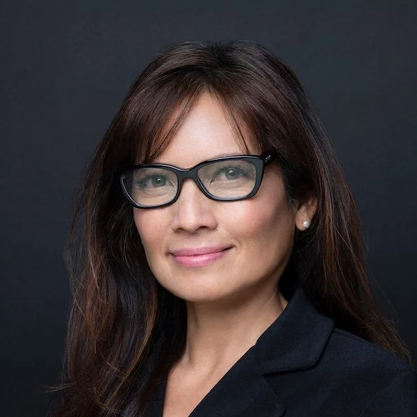 Headshot of Vivian Reiser on black background