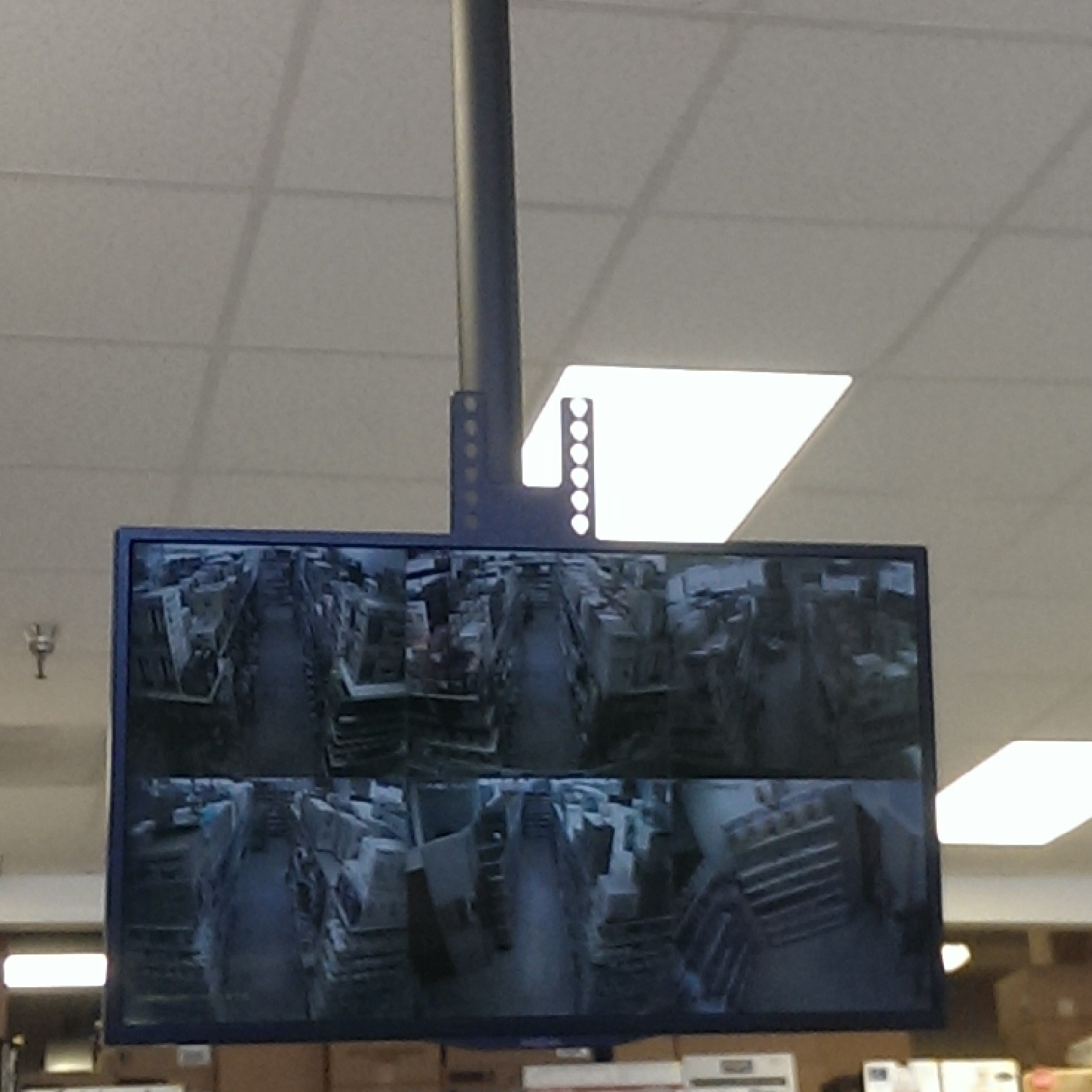 CCTV monitor on ceiling mount bracket