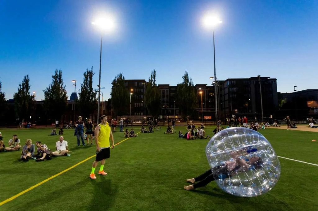 Players struggle to gain access to the center of their bouncy, blue orbs during Seattle's first "Bubble Futbol" - or soccer - tournament Sunday, September 7, 2014, at Cal Anderson Park in Capitol Hill in Seattle, Washington. The unlikely sport originated in Europe and is quickly sweeping the U.S., with a recent spotlight on The Tonight Show with Jimmy Fallon. The event was put on by Seattle-local nonprofit "The World is Fun" as a celebration of the organization's fifth anniversary. Photo: JORDAN STEAD, SEATTLEPI.COM