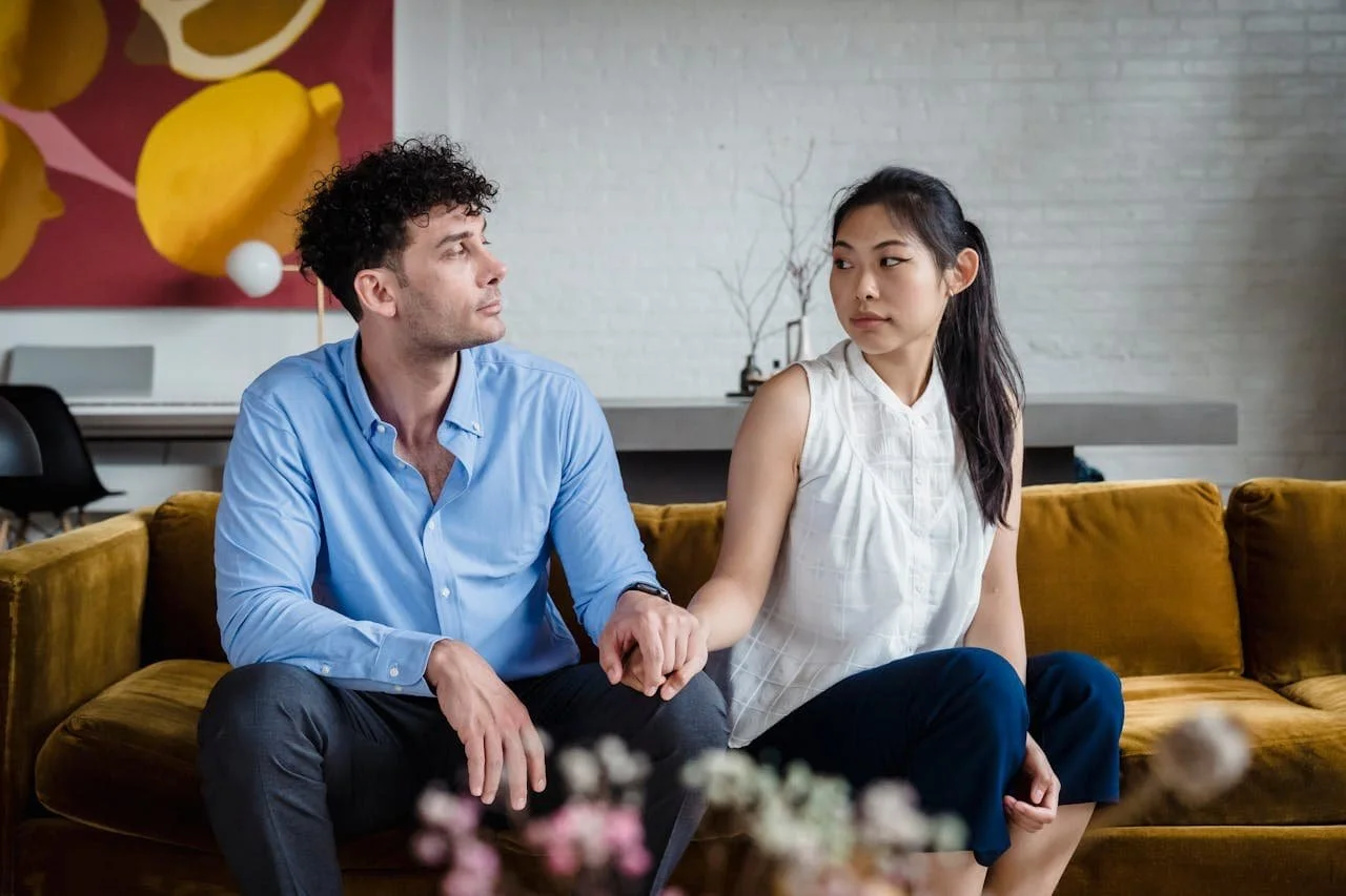 couple-looking-at-each-other-while-holding-each-others-hand