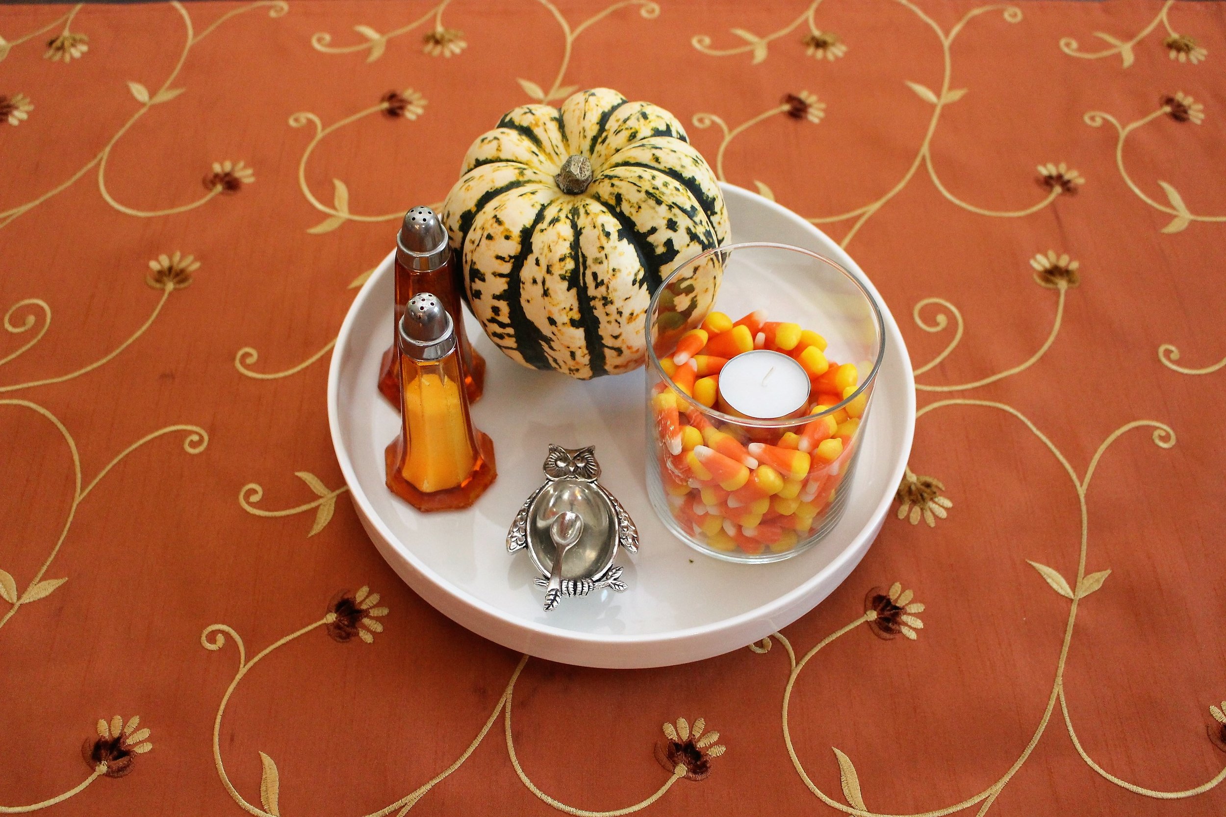 This is how I have been using a candle jar for fall. This little plate sits on the counter or on the dinner table.