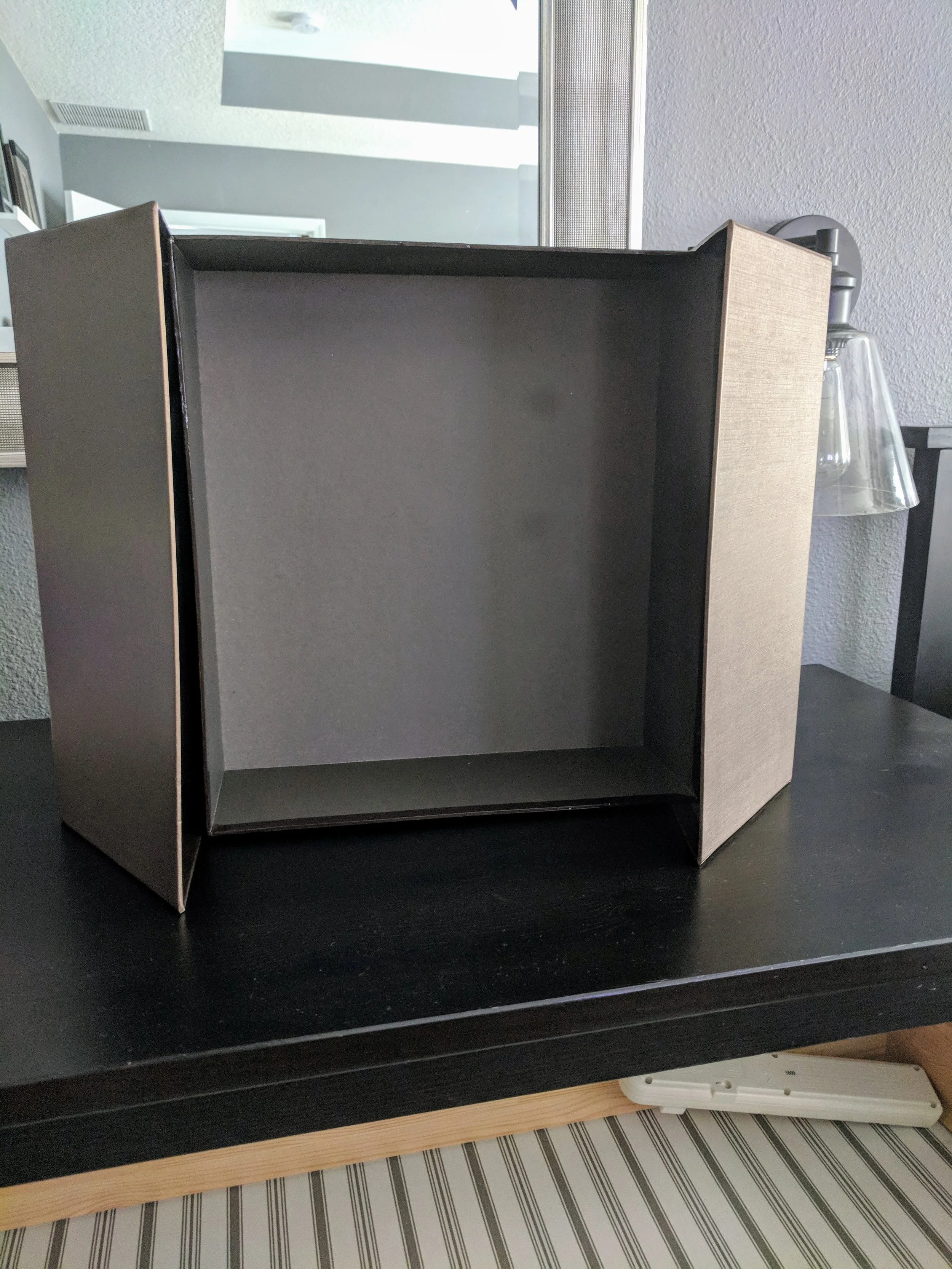 Use unexpected items to help you organize! I used this old wine gift box to organize my nightstand!