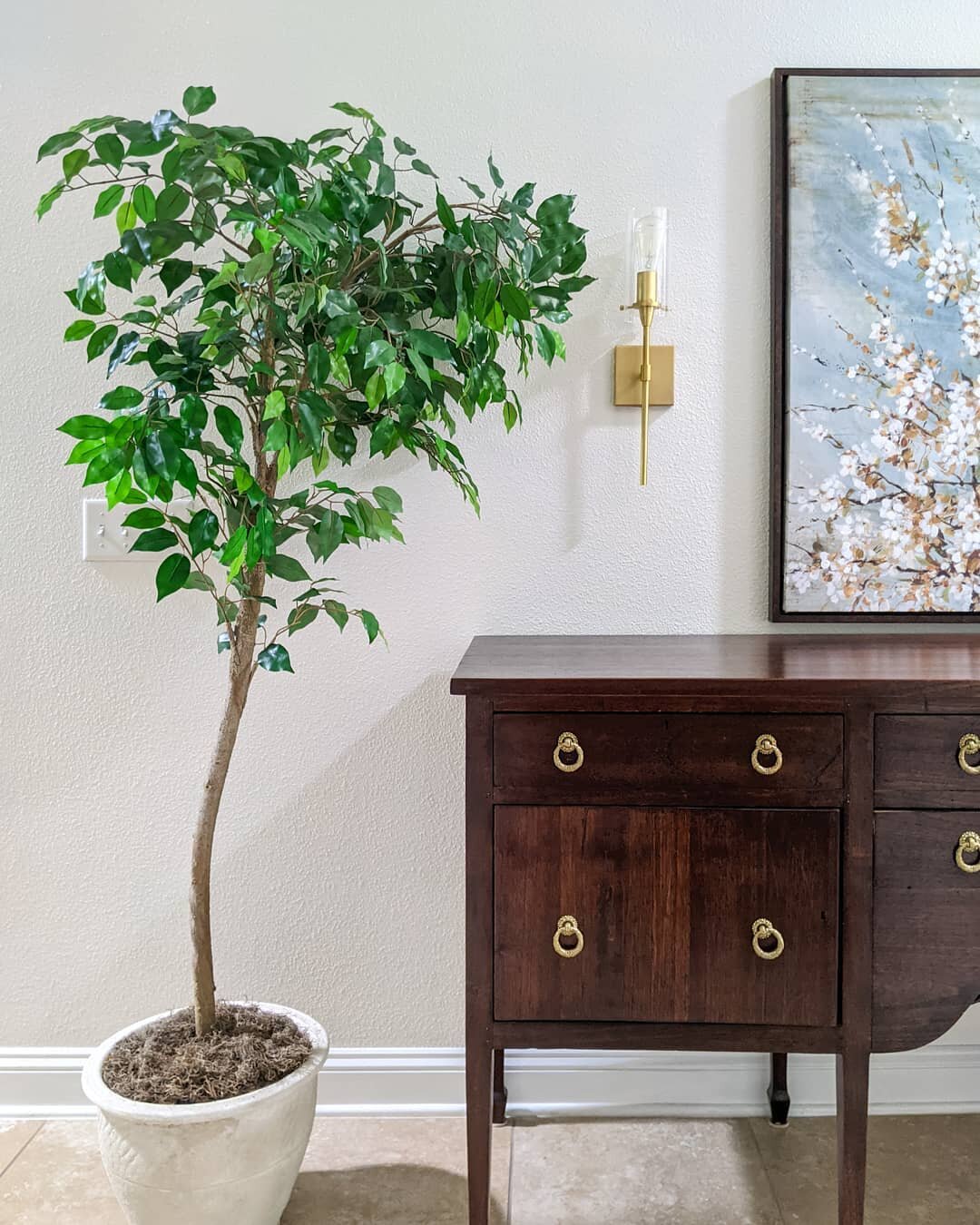 When I couldn't find a faux tree for our family room that gets no natural light, I decided to DIY one! New ones that I loved were out of my price range so making one sounded like the best option for me. I bought an old faux ficus tree from Facebook M