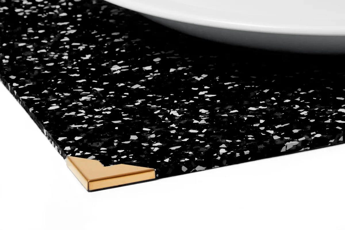 PLSB1_RubberPlacematwithBrassCorner-SpeckBlack_Detail_SlashObjects_web.jpg