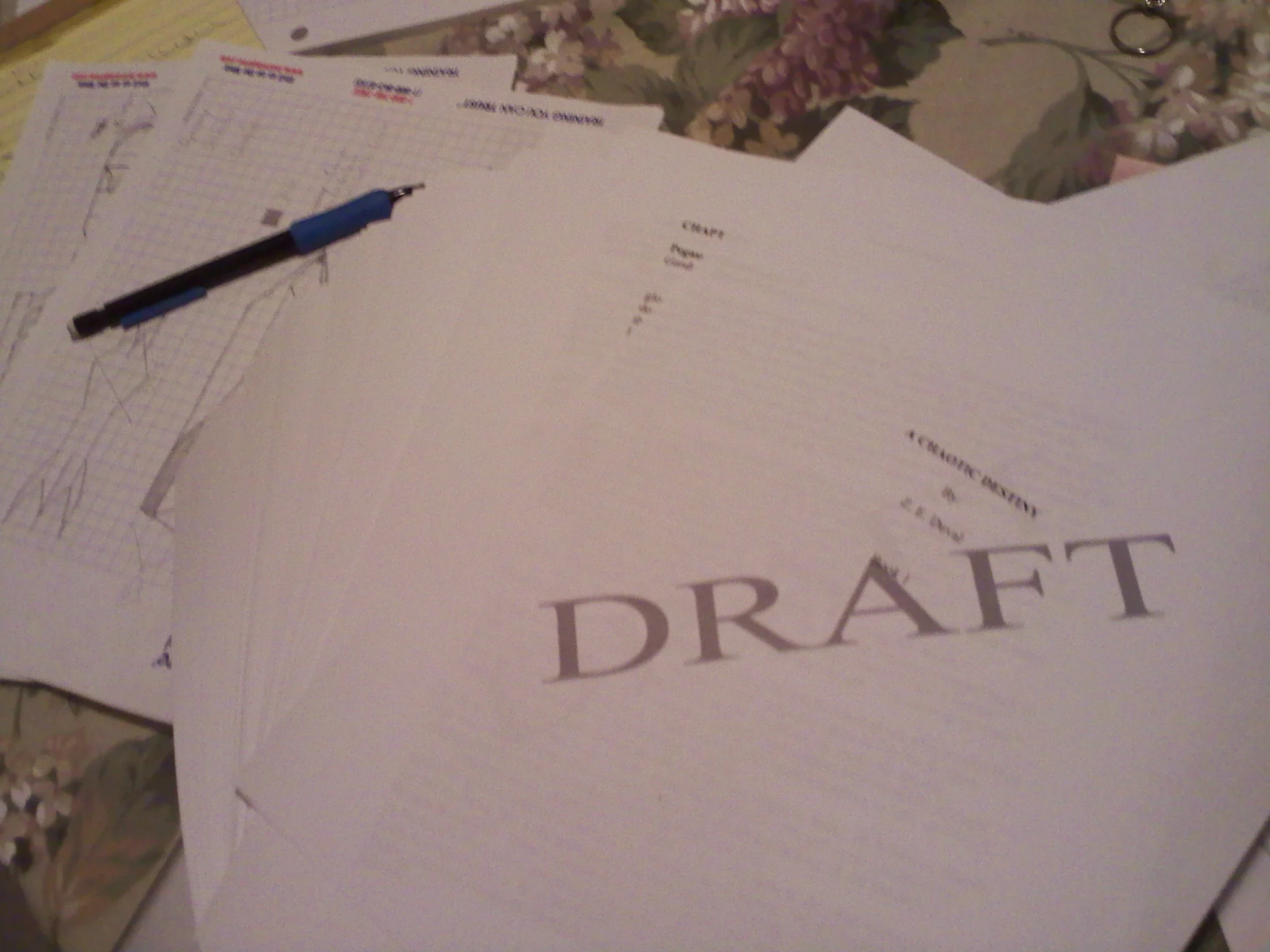 The first printed draft of "A Chaotic Destiny" circa Jan 2013. Note terrified graph paper in the background.
