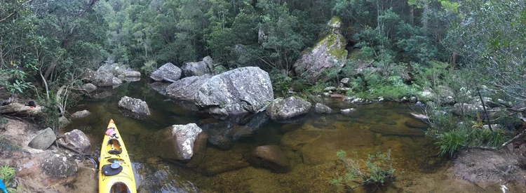 Kayaking a clear river gorge, the adventure edition of our 7-day Capital and Coast private tour