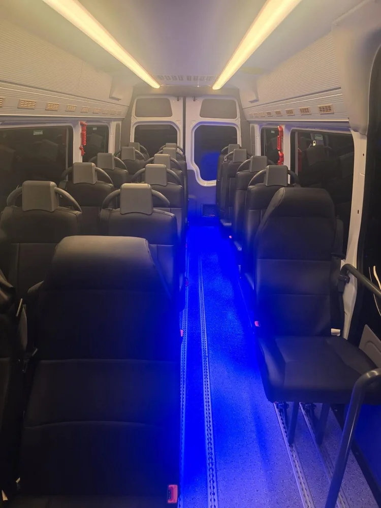 18-seater luxury Mercedes Sprinter interior with leather seats and LED lighting
