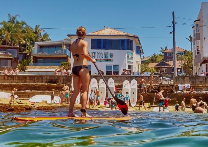 Stand-up paddleboarding team building on Sydney Harbour