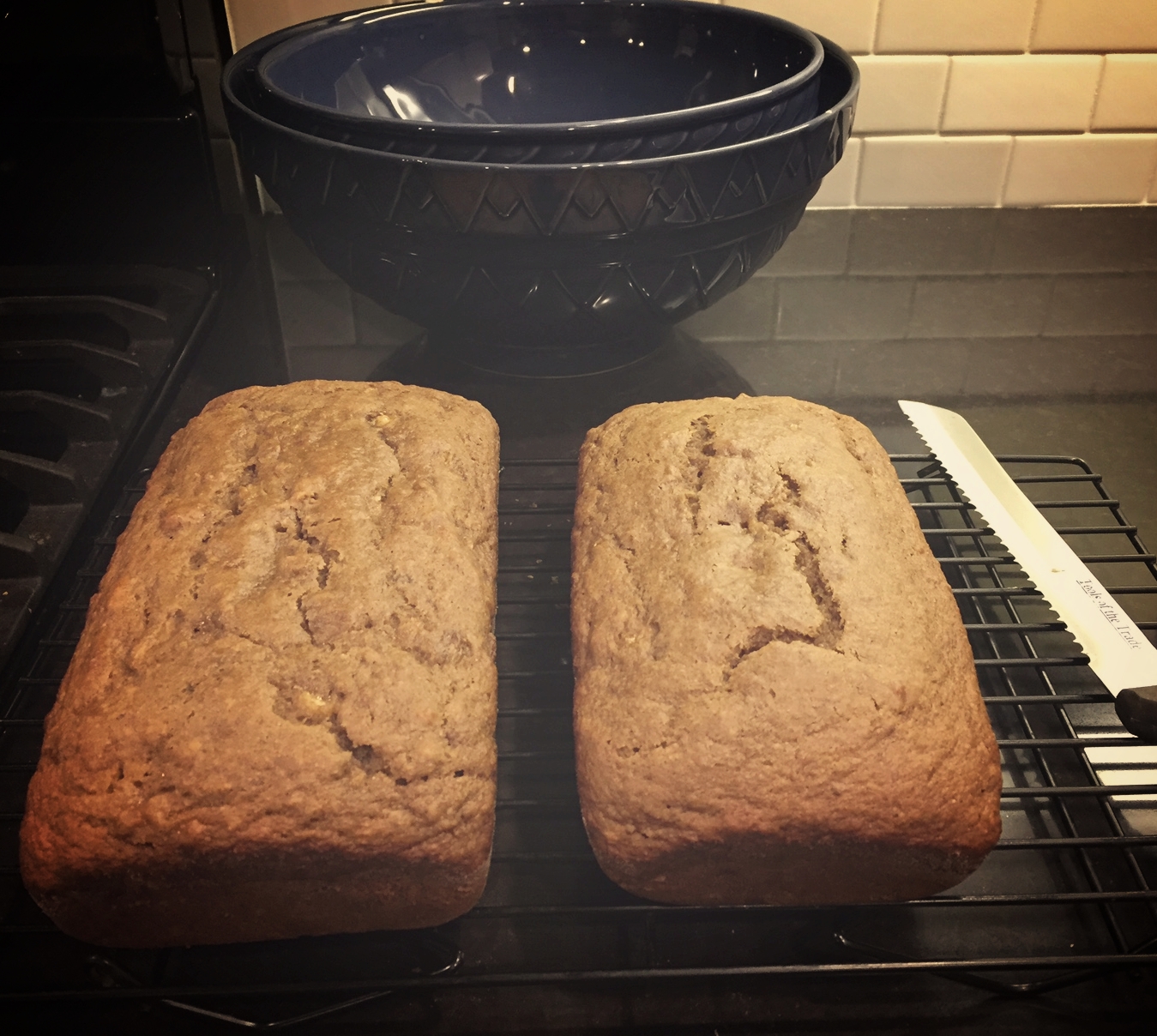 Two beautiful loaves, slightly brown and not gooey in the middle.