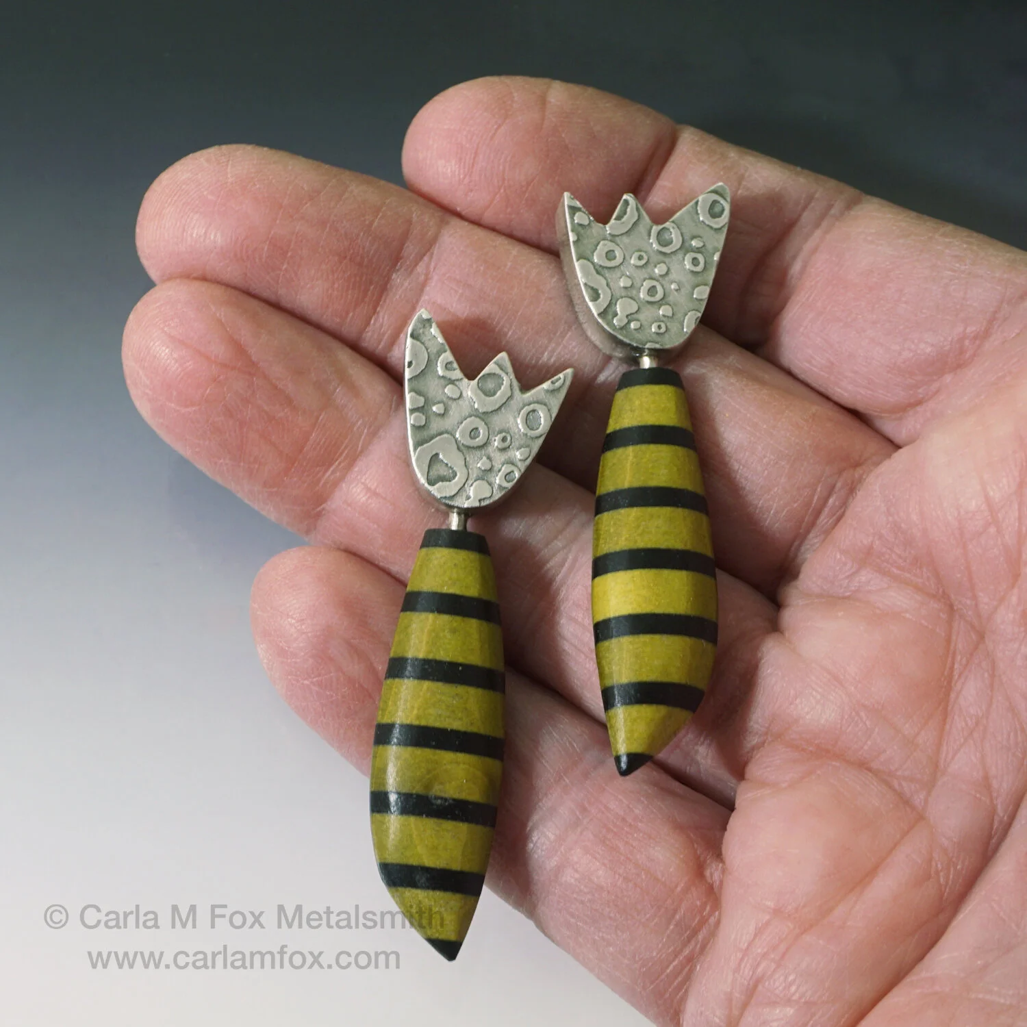 Flower + stem earrings hand-cpy-sf.jpg