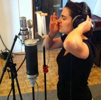 sarah at mic in studio.jpg