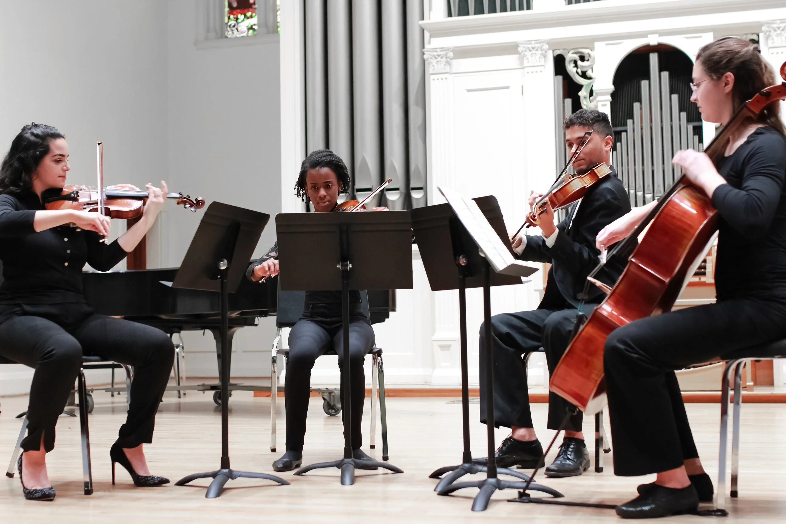 Gabriella Martinez (violin 1), Jaida Hawkins (violin 2), Kristian Gonzalez (viola), Megan Savage (cello)
