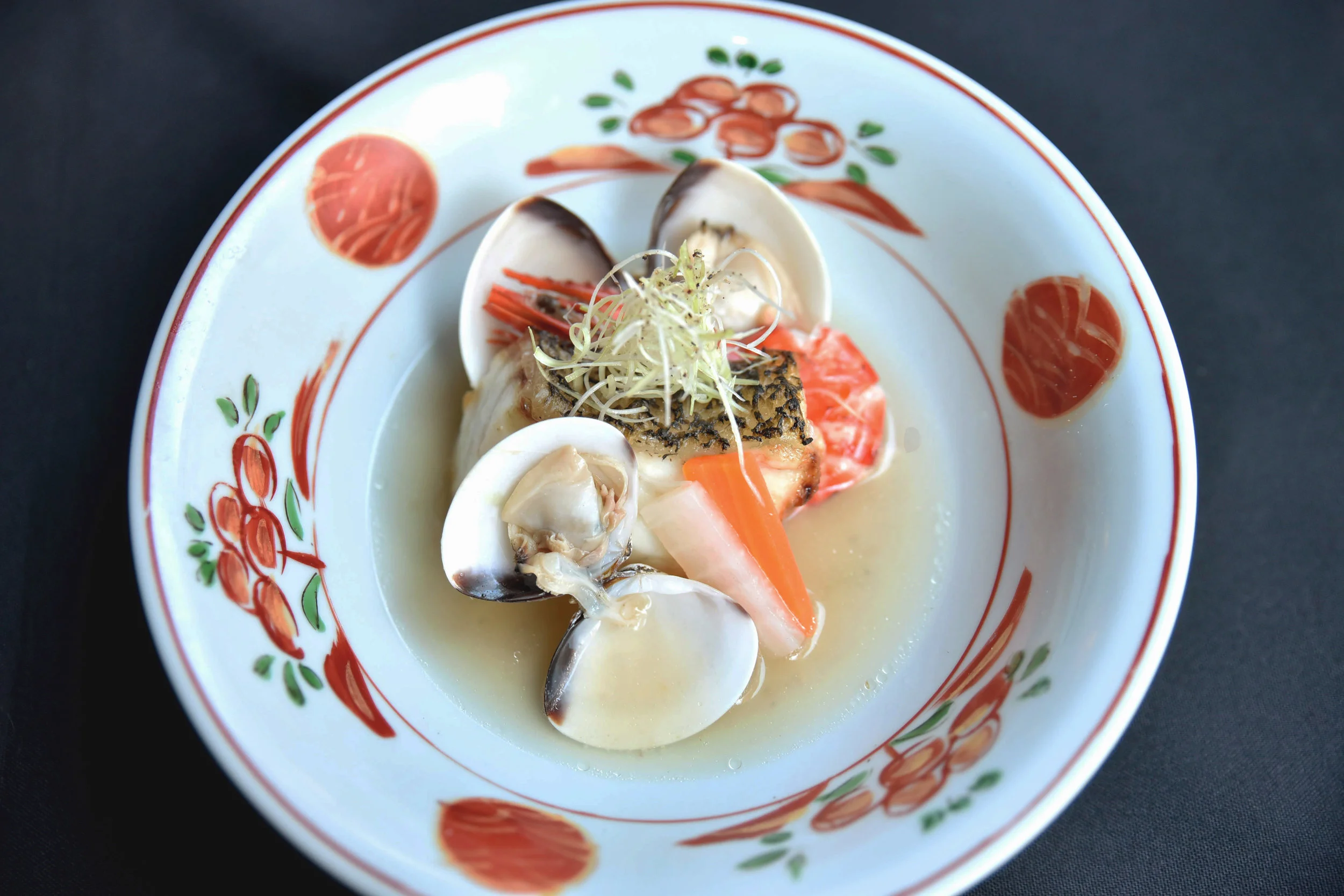 Kaiseki Spring - Cod slow cooked and served in clear broth soup with clam, king prawn, white radish, black pepper