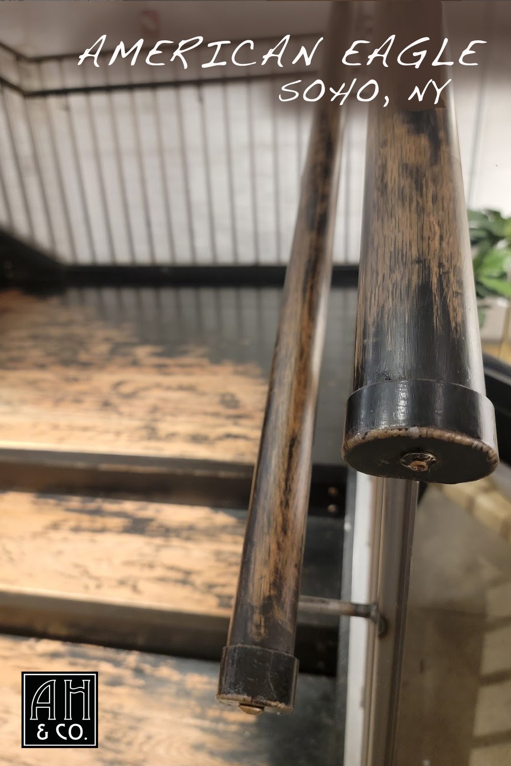 ariana-hoffman-distressed-wood-railing-paint-american-eagle-jean-soho-plaster-brick-patina-old-historical-retail-design-commercial-decor-unique.jpg