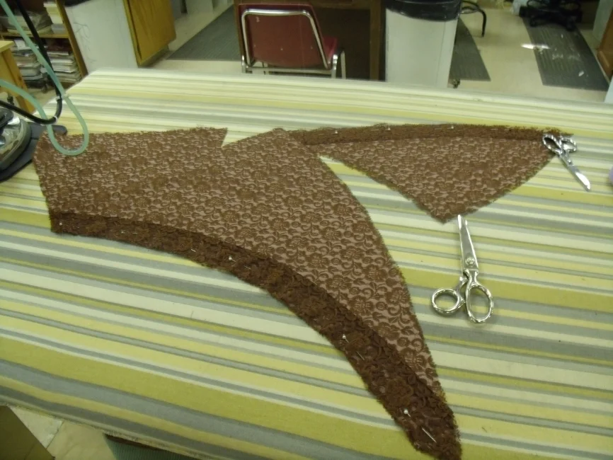  Front bodice and panel for skirt with bias trim pinned on. 