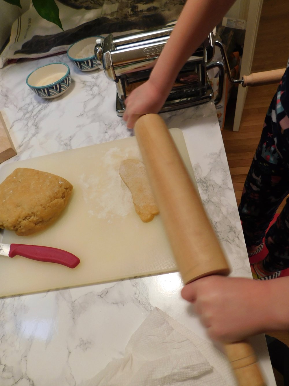 prepping dough to roll