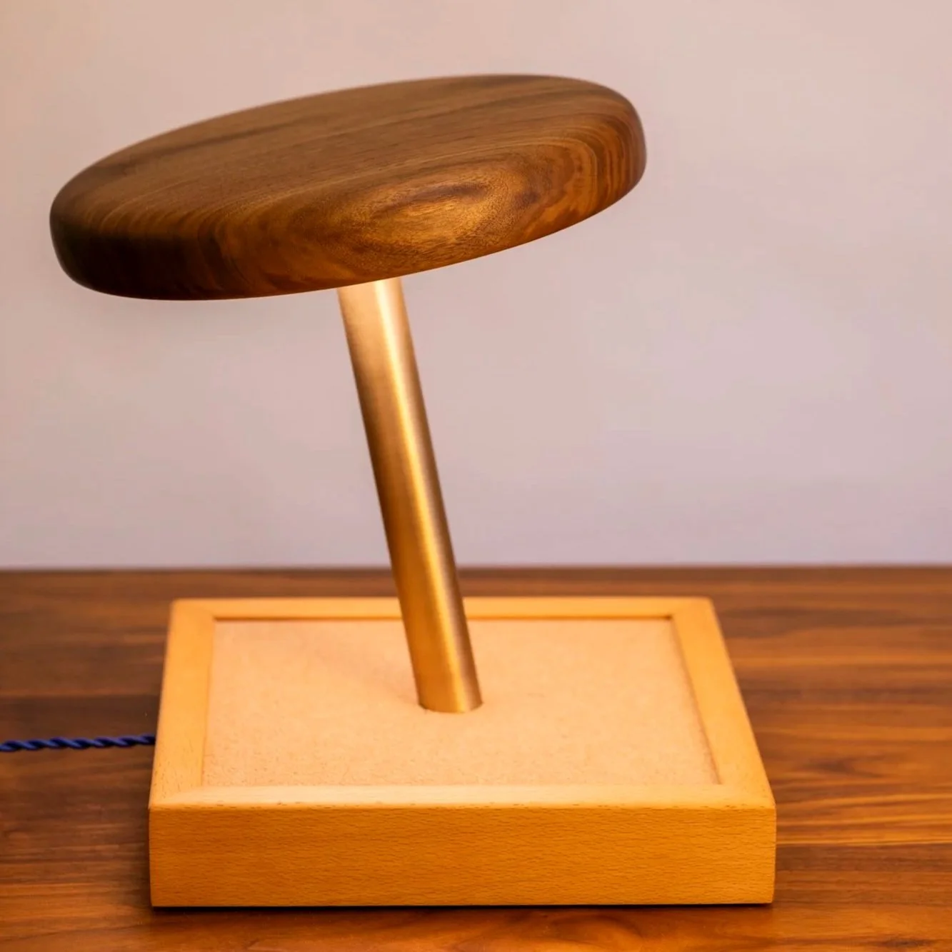 A larger-than-life Walnut thumbtack that lights up your space — literally.
