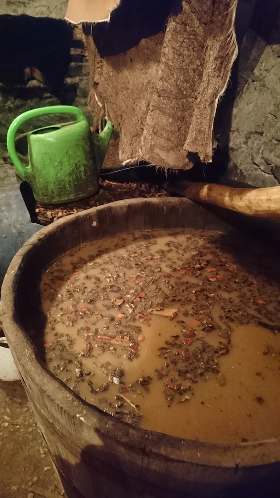 Here, Martin is tanning the skins using a specific kind of tree bark mixed with salt and water. A skin can sit in the tank for weeks until it is ready, which is why 99% of all commercial leather products are now tanned using a chromium chemical treatment. The tanning time is significantly reduced, but the toxicity of the treatments cause severe implications: http://gizmodo.com/how-leather-is-slowly-killing-the-people-and-places-tha-1572678618