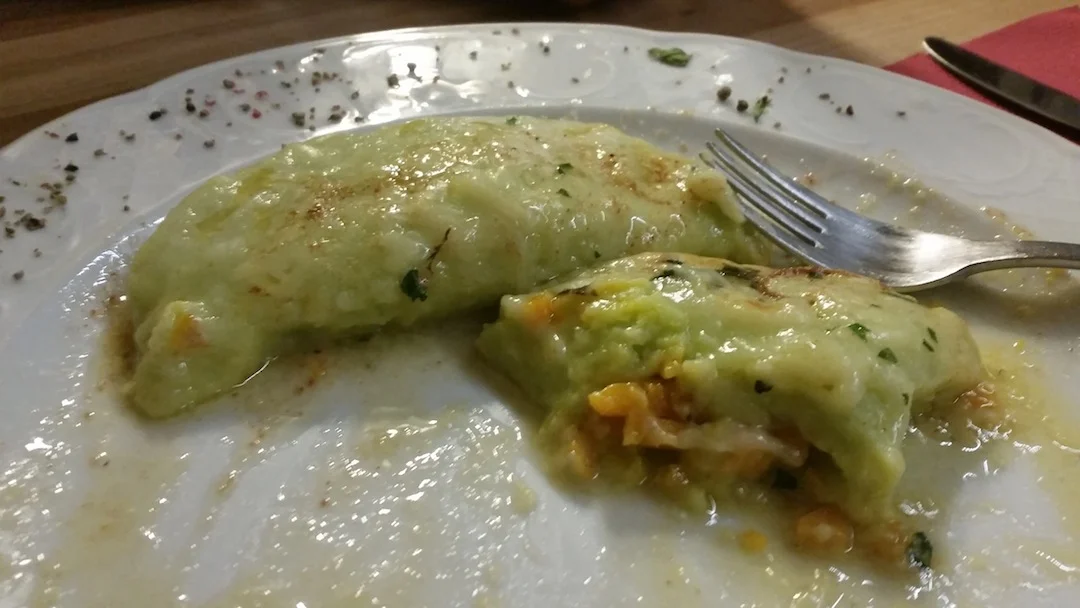 Homemade potato and pumpkin dumplings at the Tschenglsburg Castle. Once used for provincial rulers in the medieval era, the castle has since been converted into a cozy local restaurant and bar.