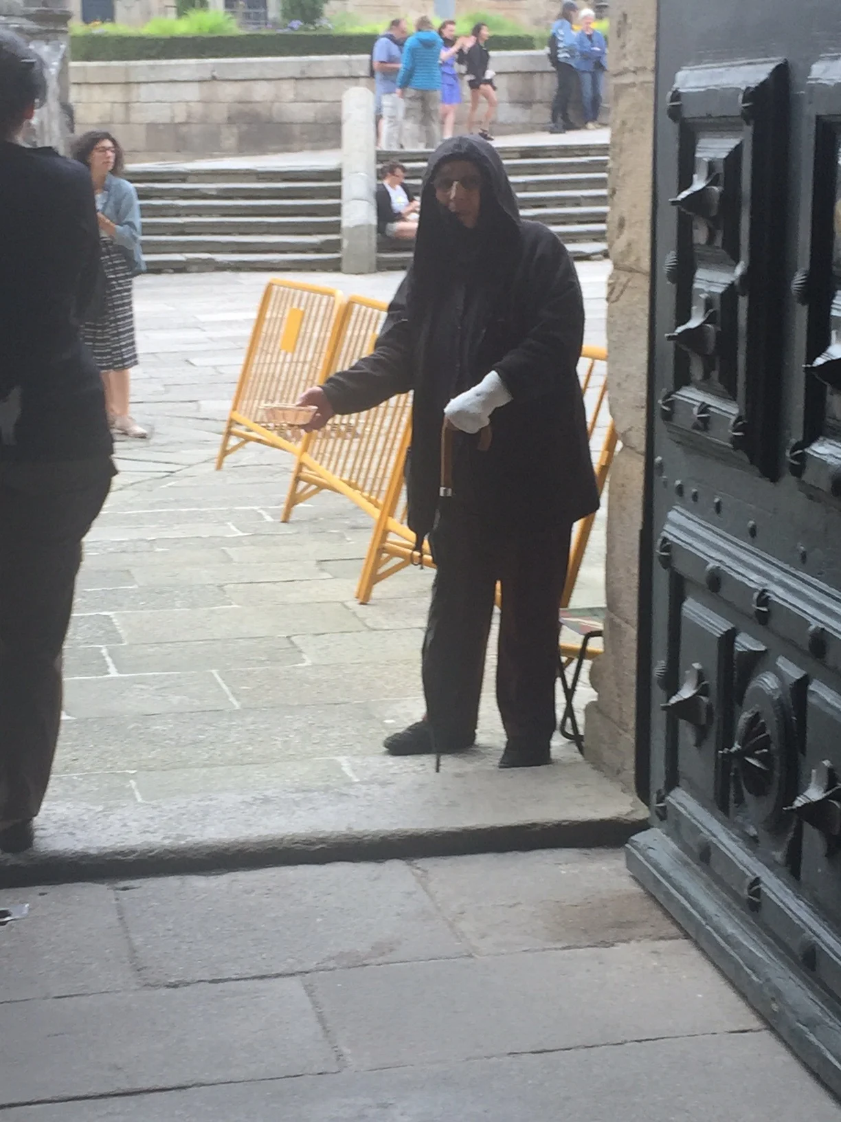 Begger at the door after Mass
