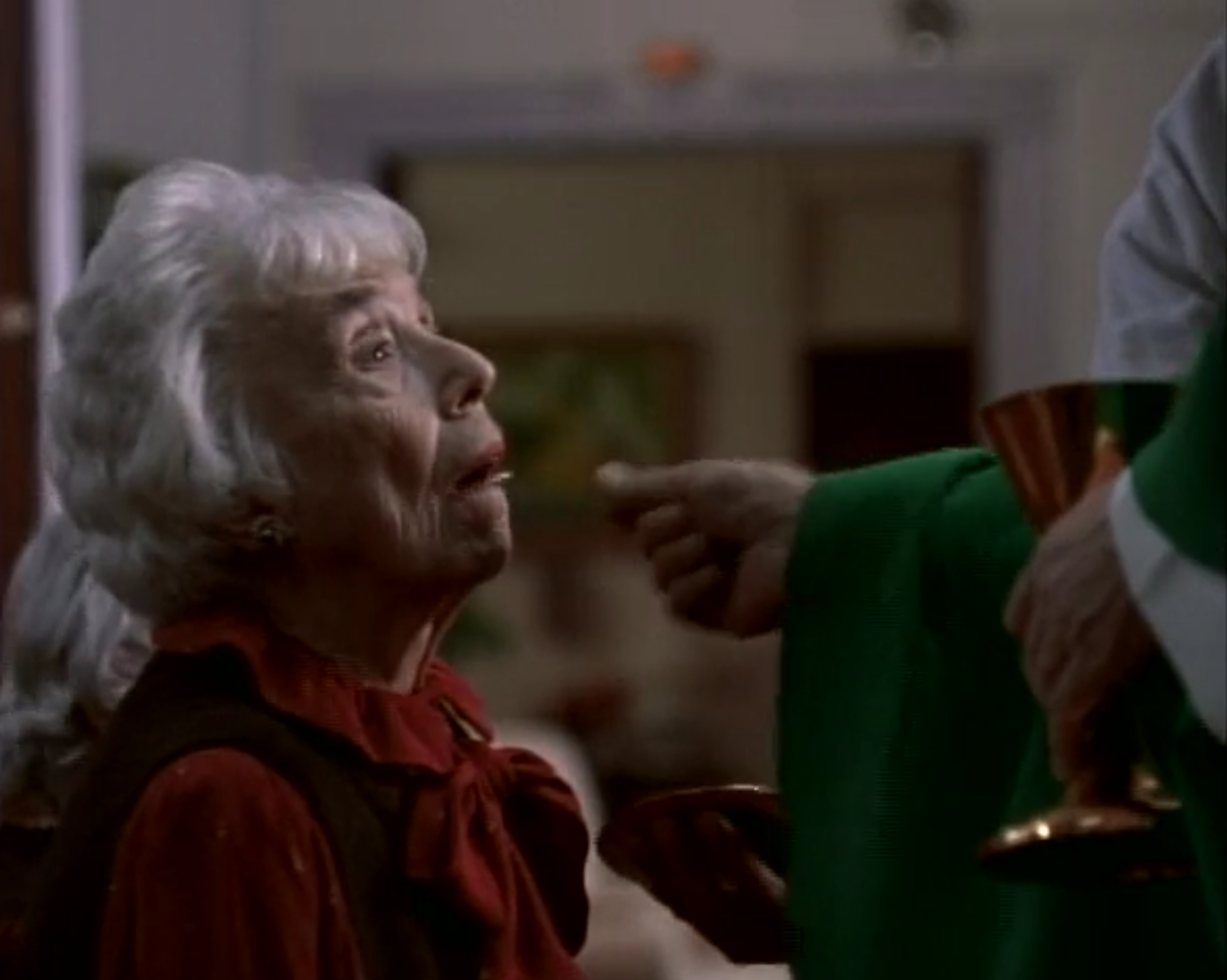 Me giving Sophie communion in The Opportunist.