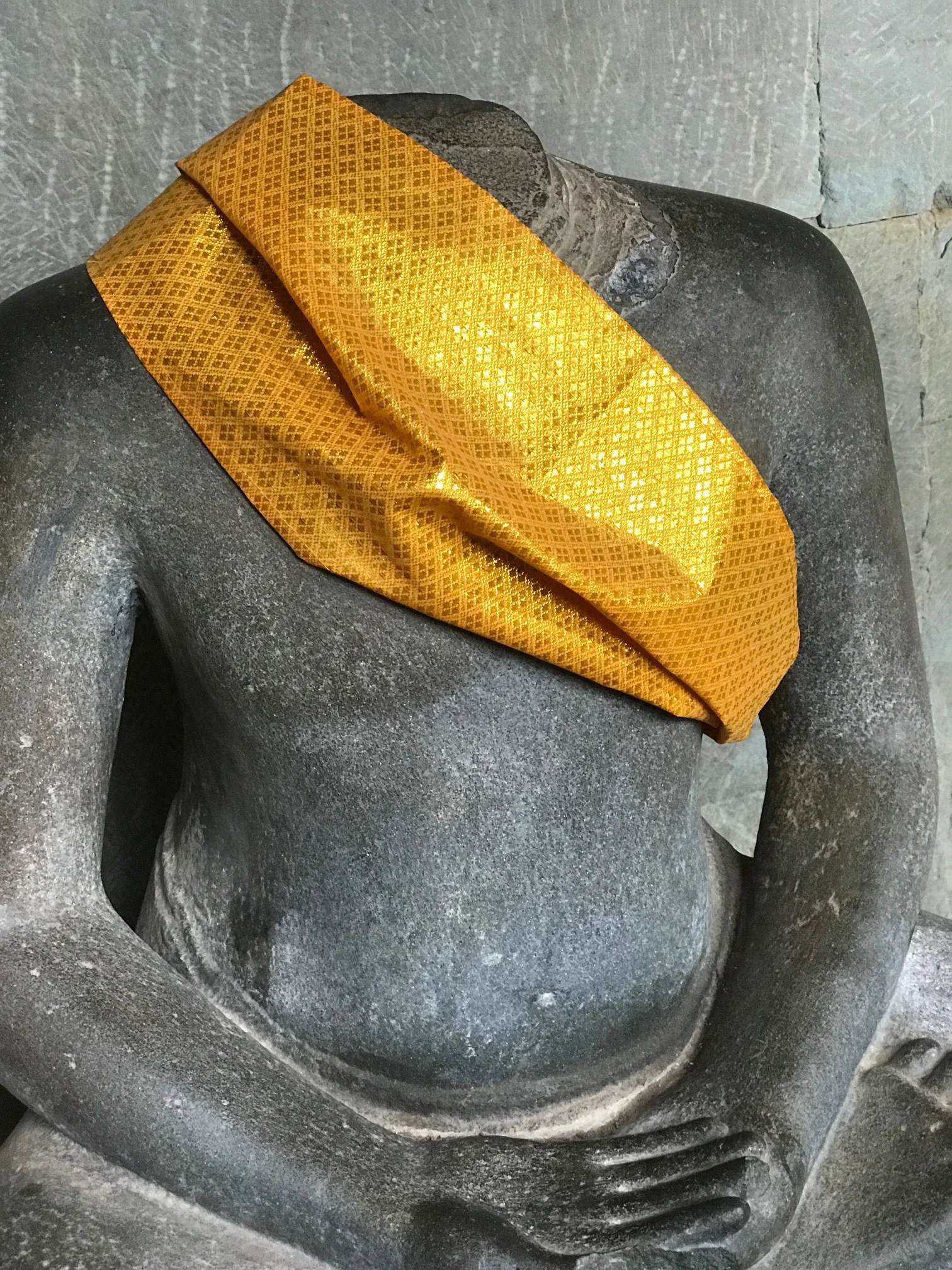 Many headless Buddhas in Angkor Wat, stolen for $$