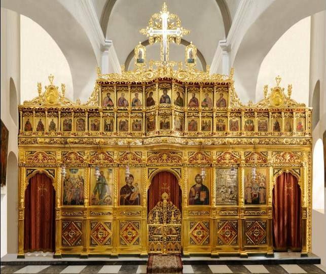 Behind this elaborate screen is the priest alone with the Eucharist.