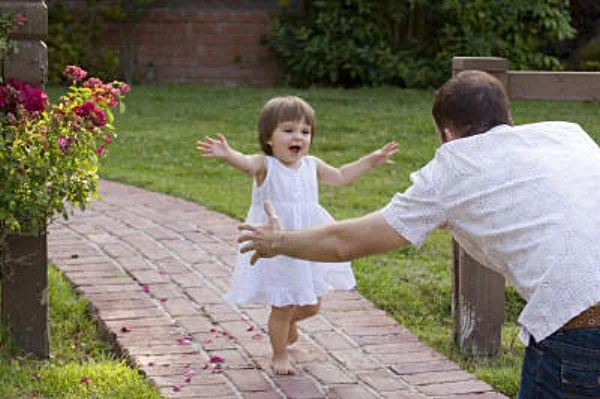 Little girl running to dad's open arms.jpg