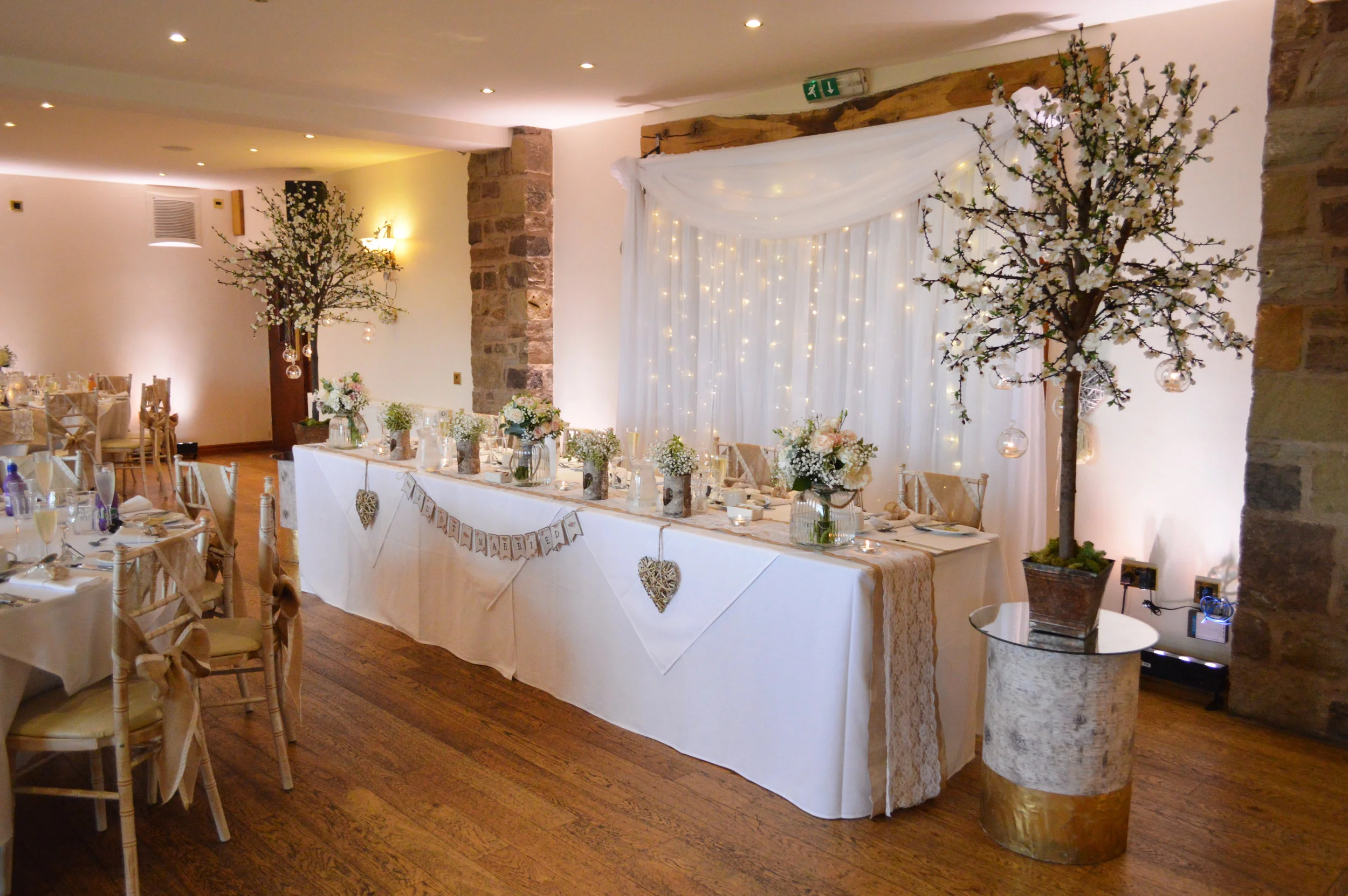 Blossom trees next to the top table