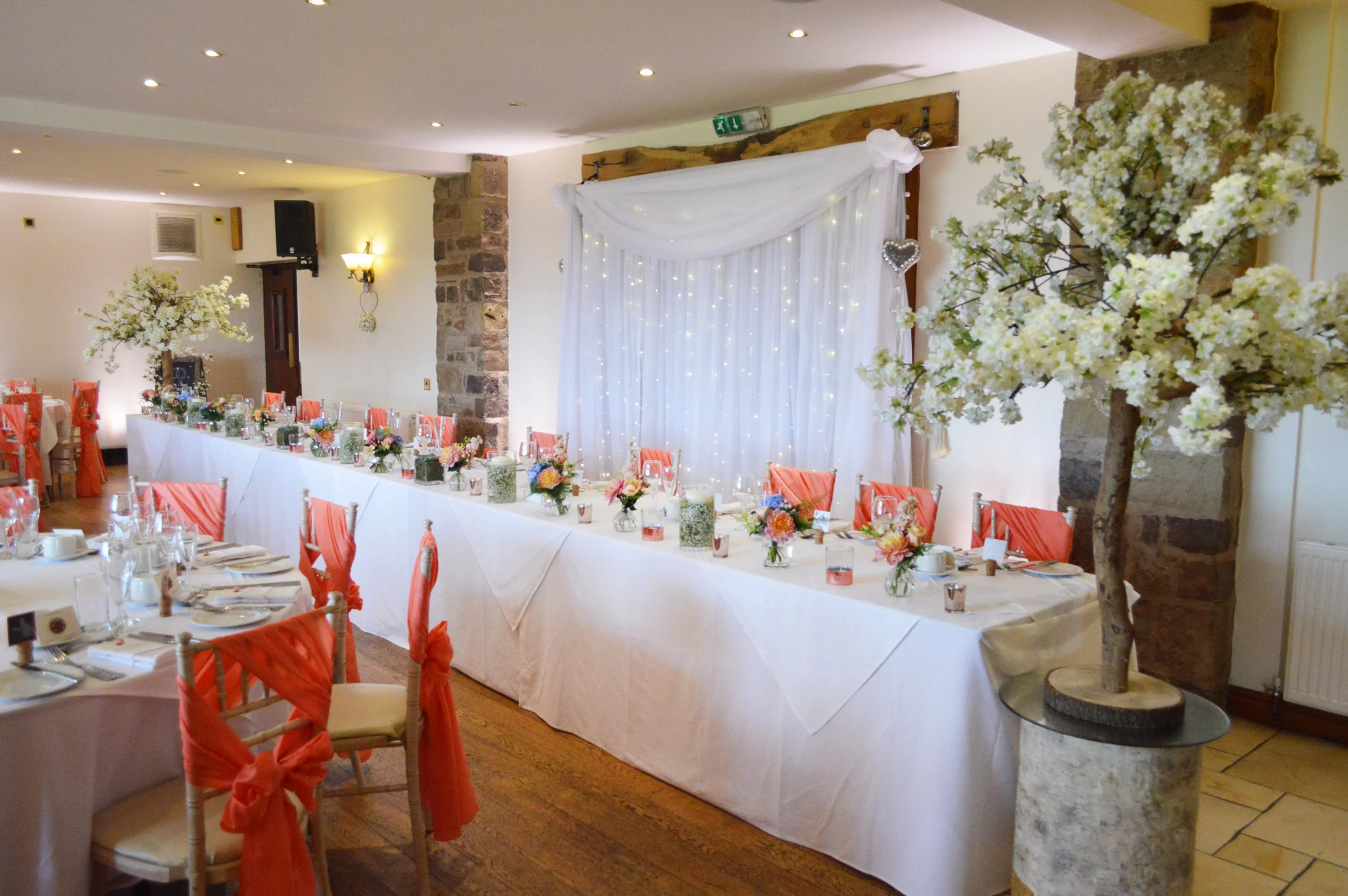 Blossom trees next to the top table