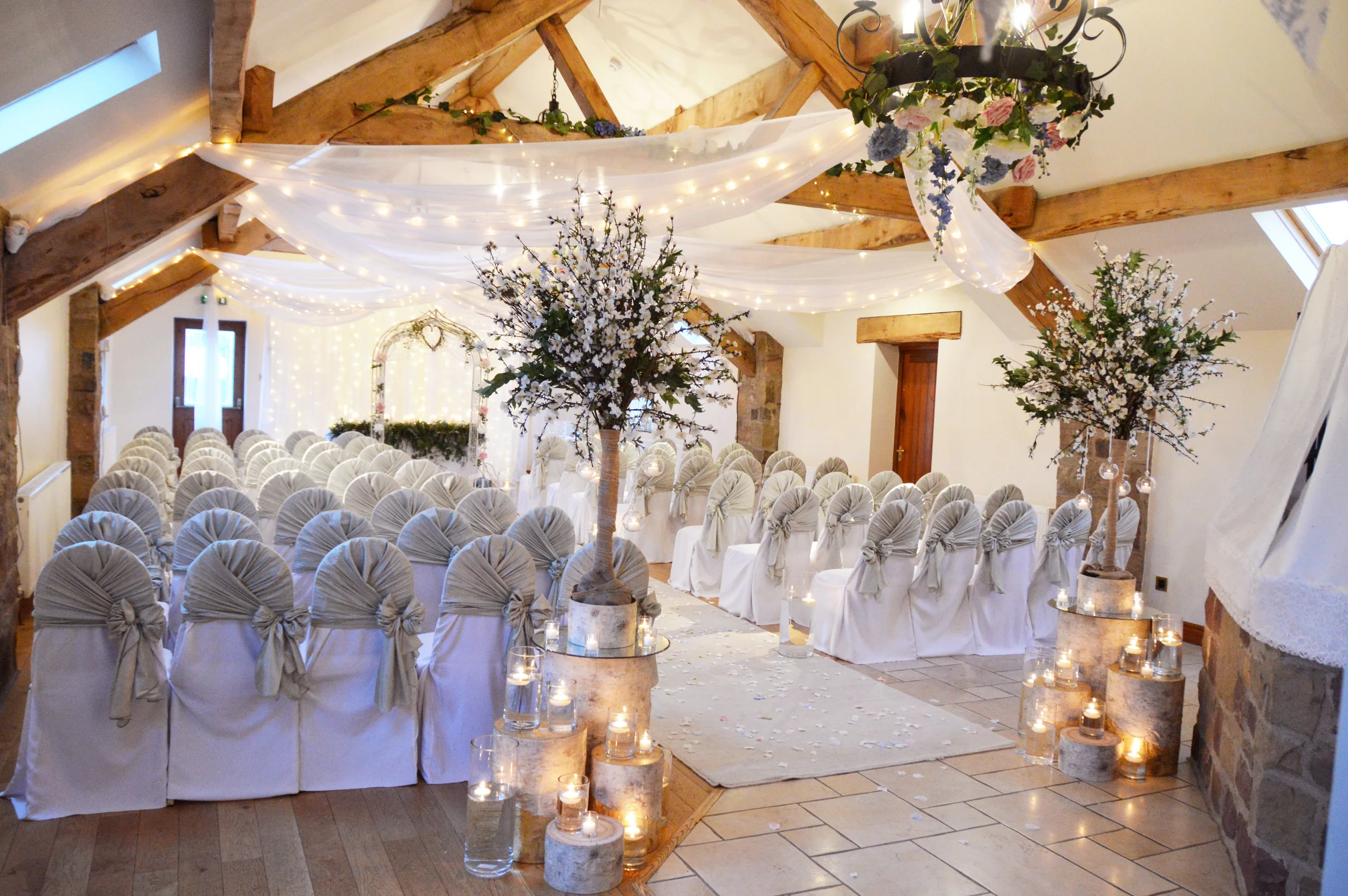 Blossom trees with wooden logs and candles