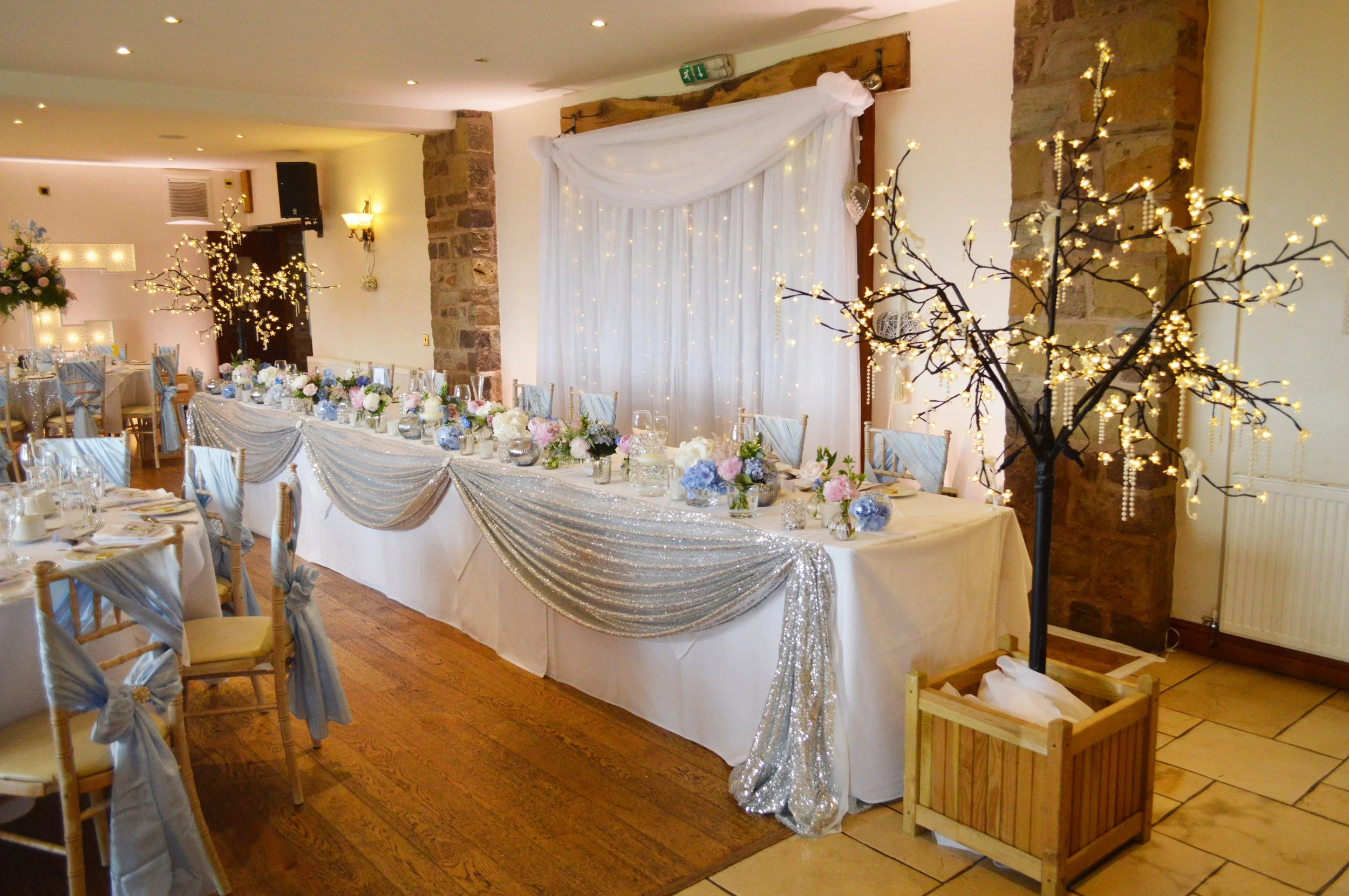 Fairy light trees and top table sequin drape