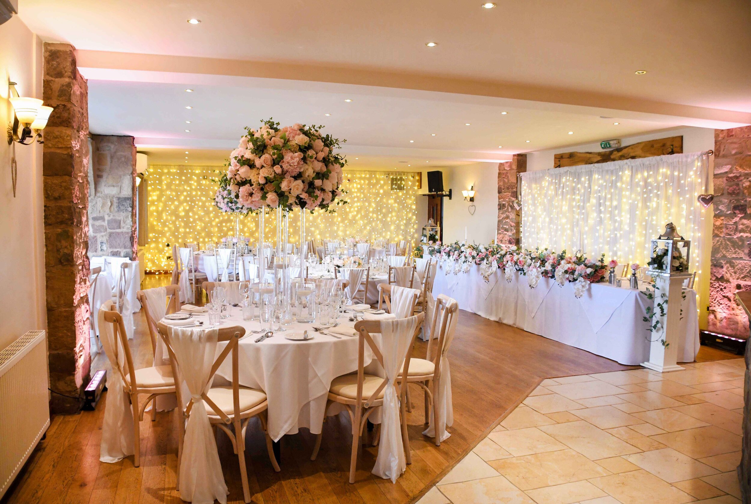 lowmegWoodland Room showing fairy lights on back wall and behind top table.jpg