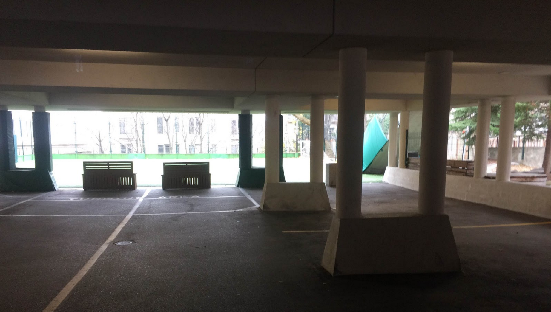 Pre-2016 parking garage under the gym. It claimed the sides of more than a few fine cars.