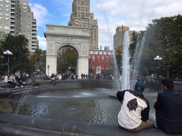 Beyond its central fountain, we see the famous Washington Square Arch (now marble, originally constructed of plaster & wood for the centennial of George Washington's inauguration in New York), as well as a row of Greek-revival townhouses dating back to 1832.
