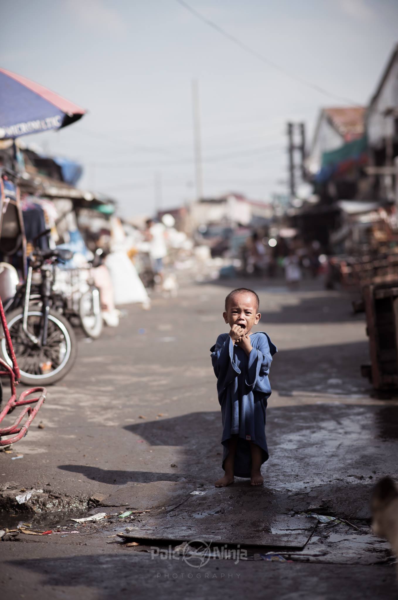  I thought this kid looked like a monk as he came running forward toward us. As with the other picture, I don't know why he is crying, so please don't make assumptions. But I did feel bad for whatever his plight was. 