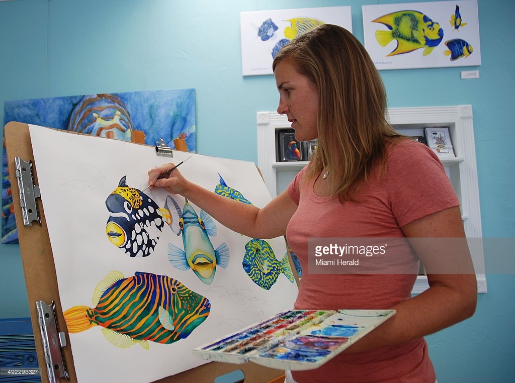 Artist Michelle Nicole Lowe paints in her Islamorada Gallery.
