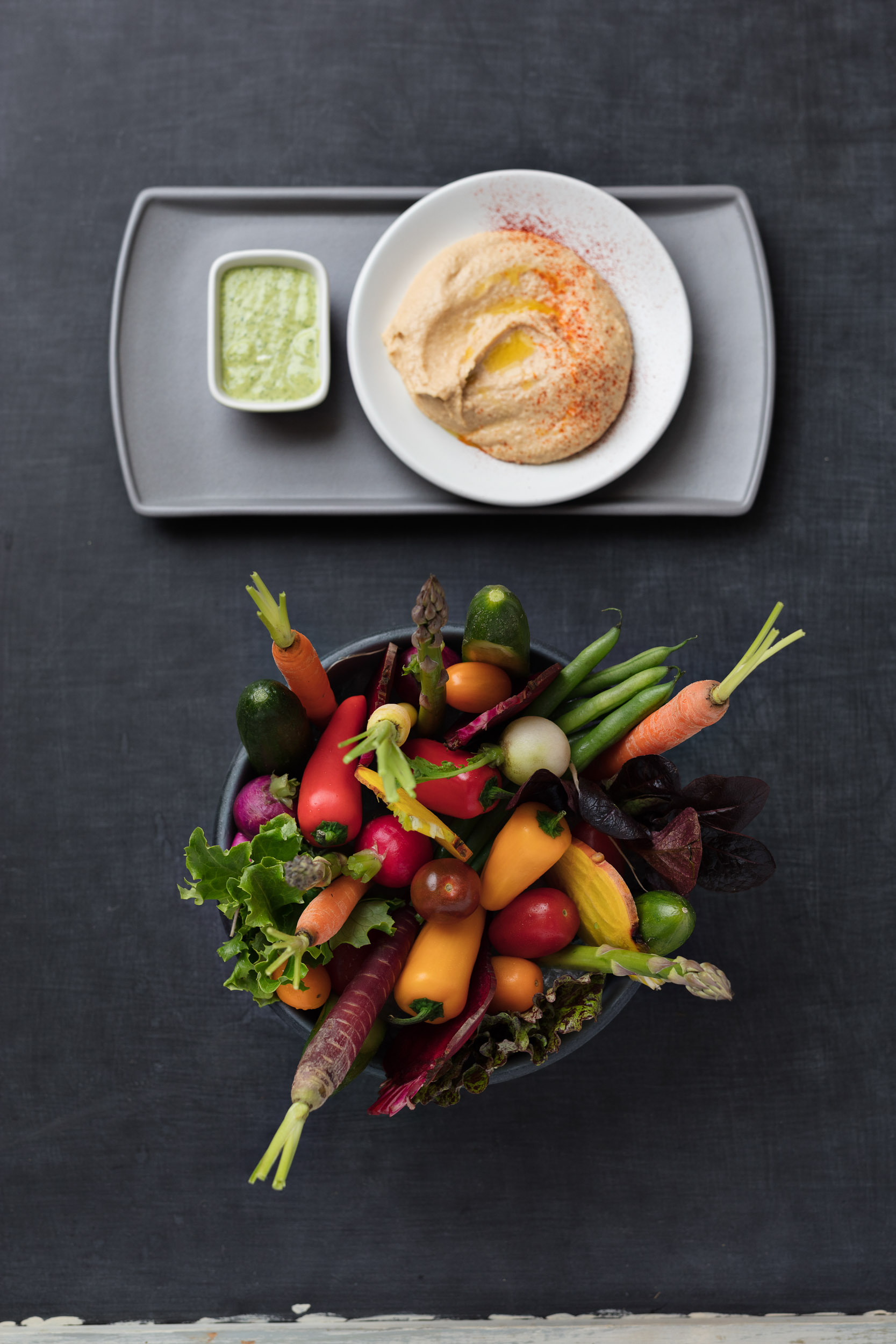 Heirloom vegetables with olive oil hummus