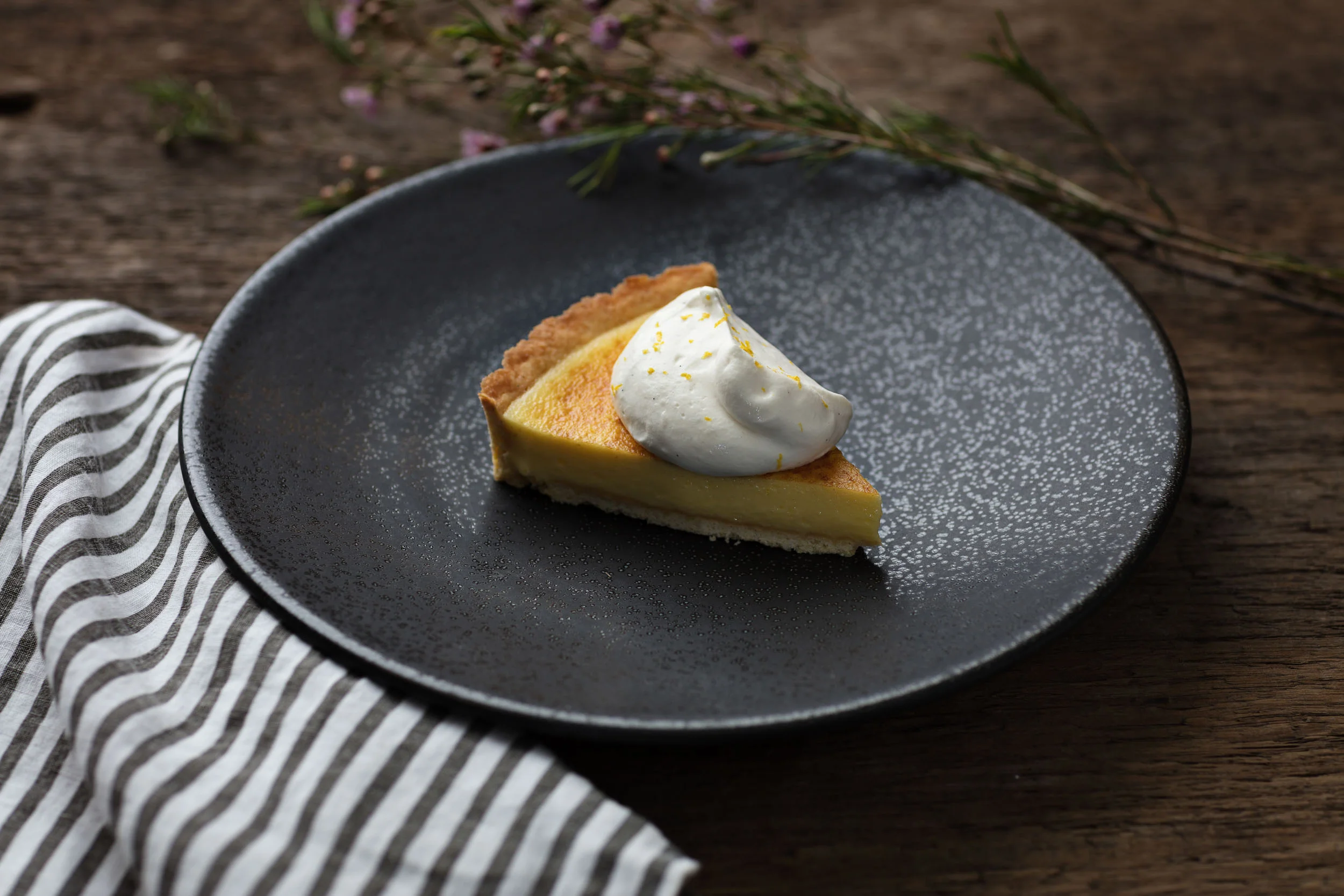 Homemade pumpkin pie with hand whipped cream