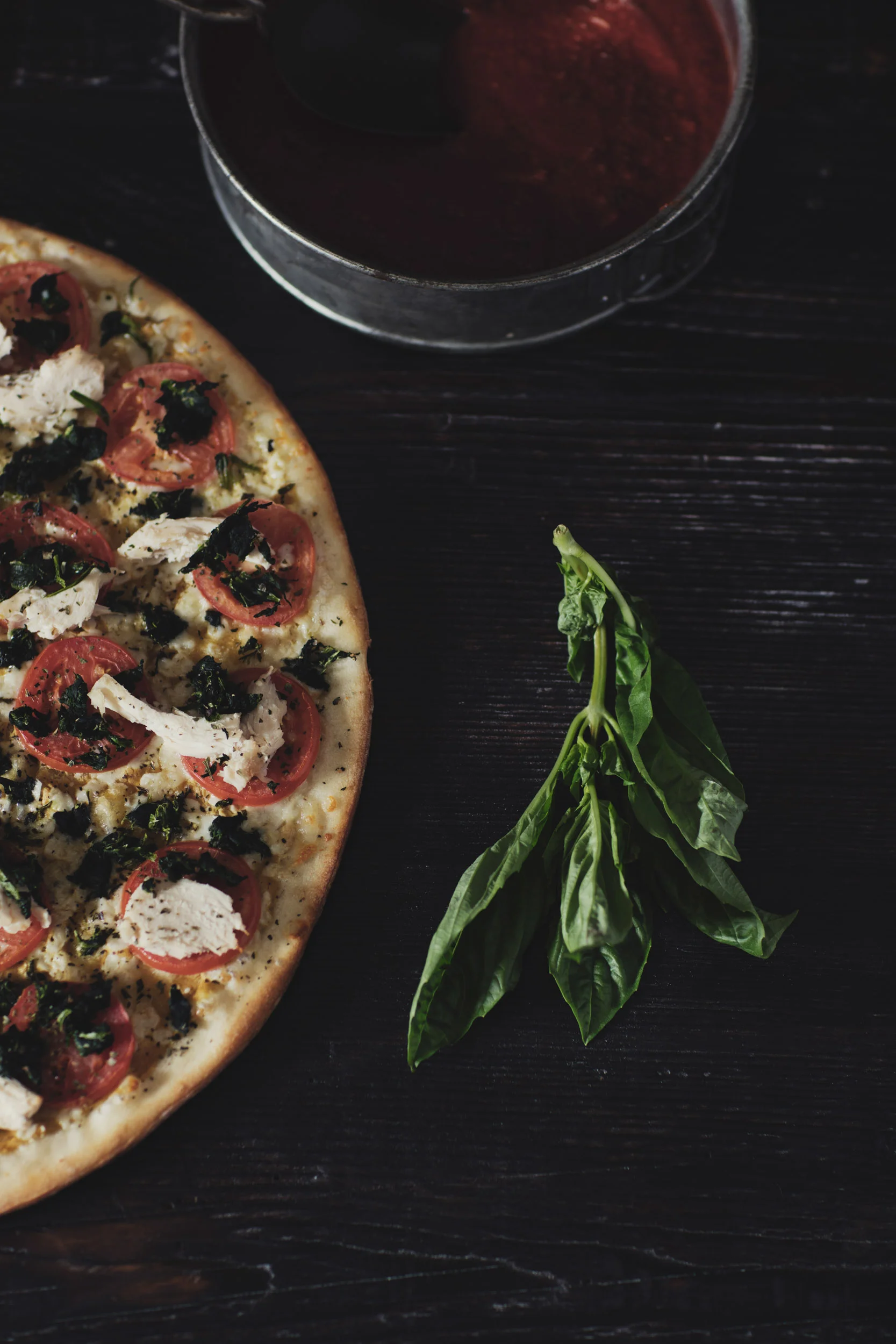 Fresh baked margherita pizza on wood table with basil 