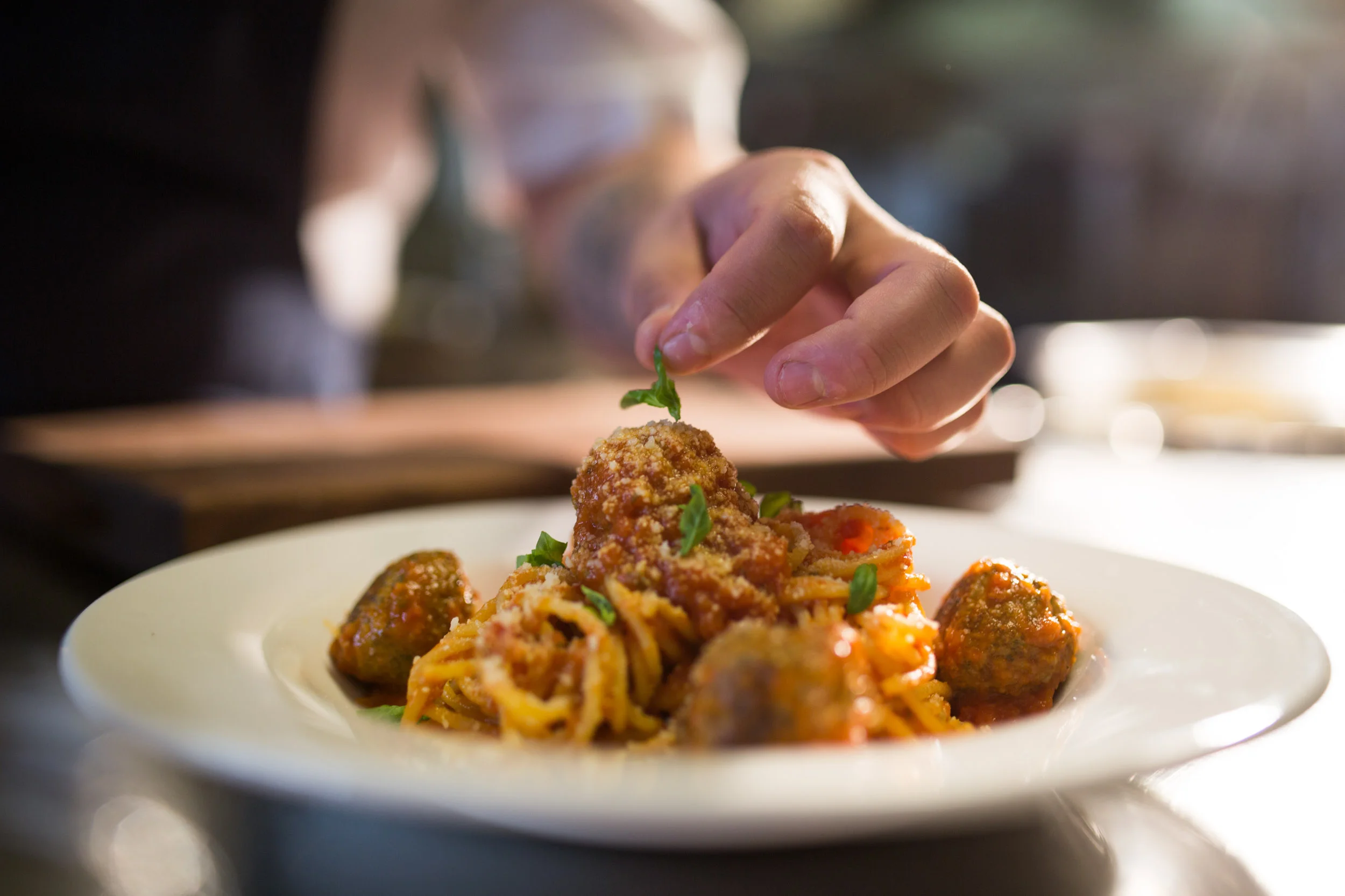 Handmade pasta with spaghetti and meatballs and microbasil 